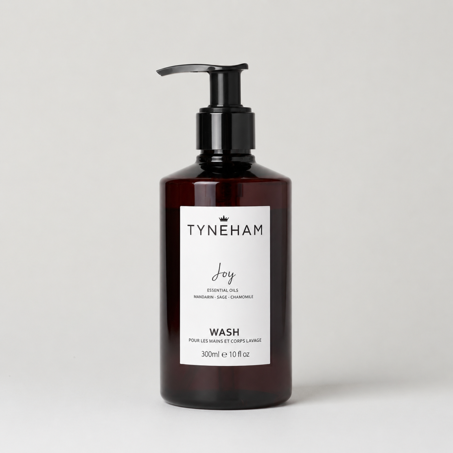Tyneham Joy hand and body wash bottle with pump on a light gray background
